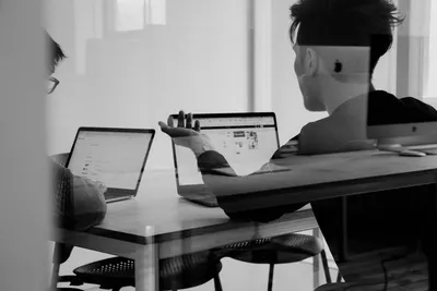 Person researching on laptop, representing search intent research